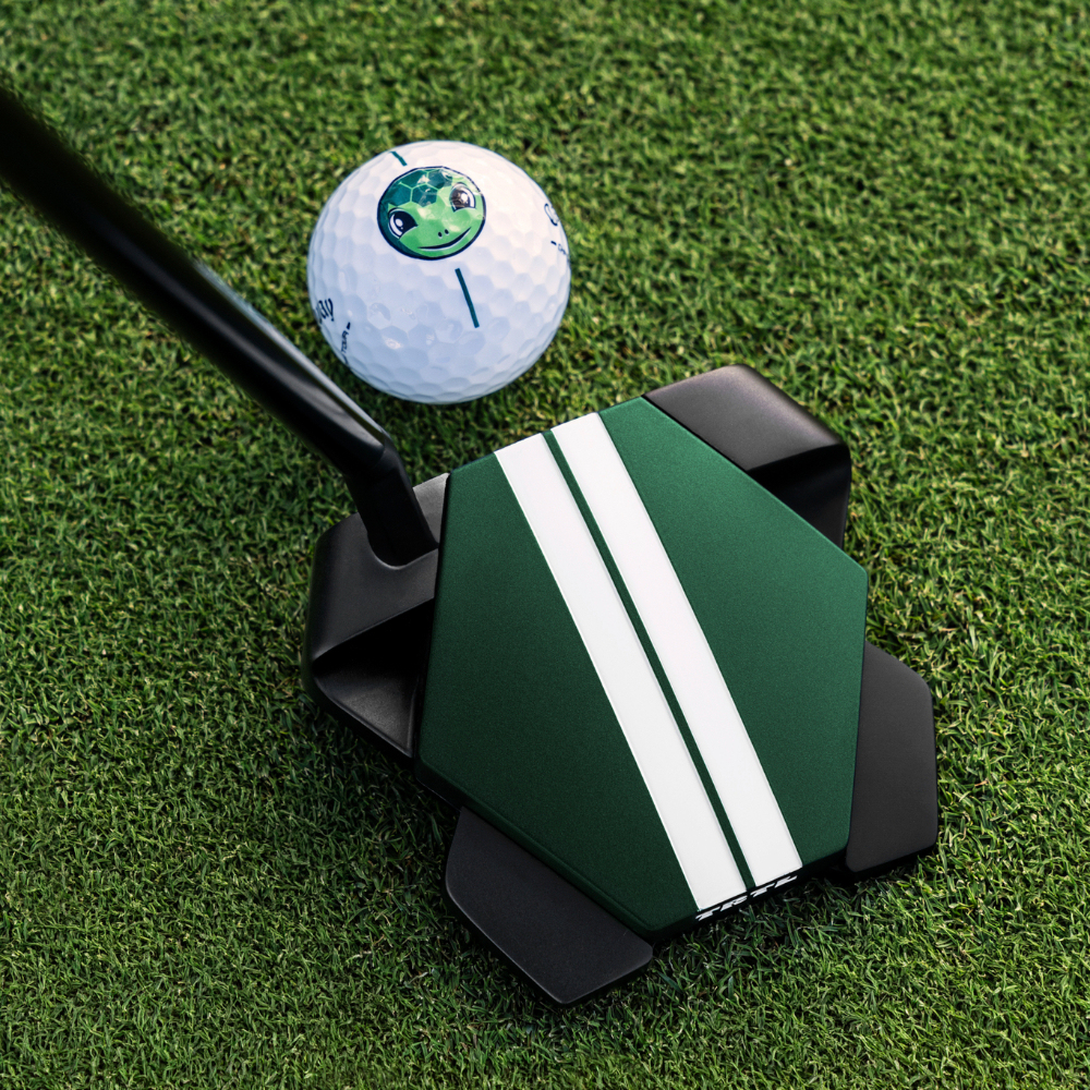 Golfer lining up a putt with the Odyssey TRTL putter