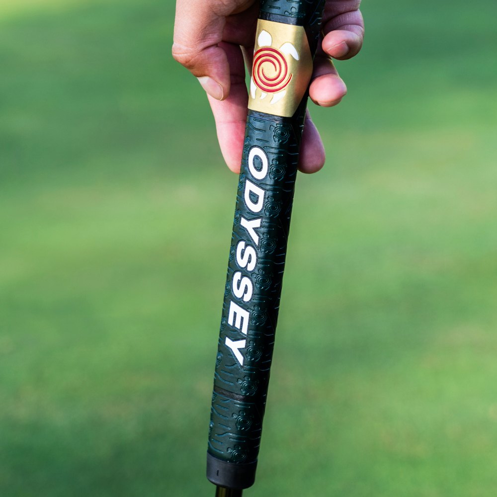 Odyssey TRTL putter resting on the green