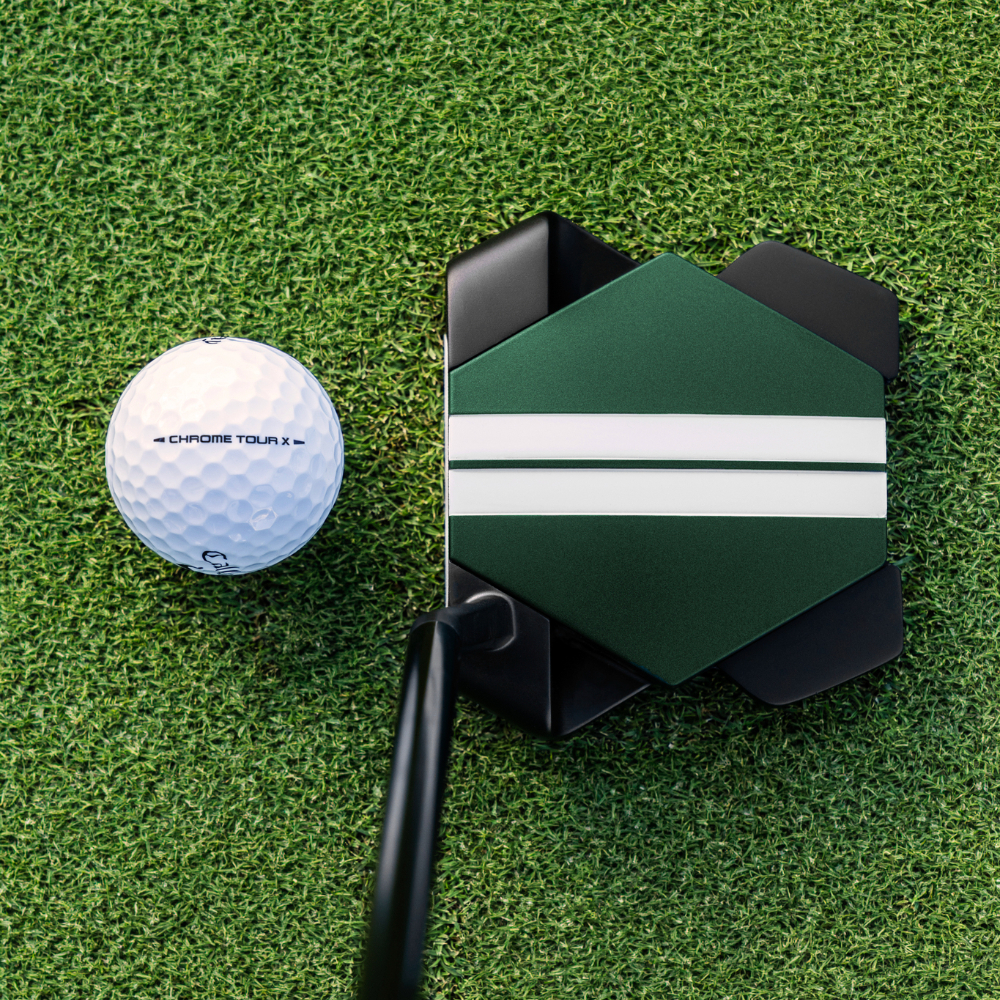 Golfer holding the Odyssey TRTL putter